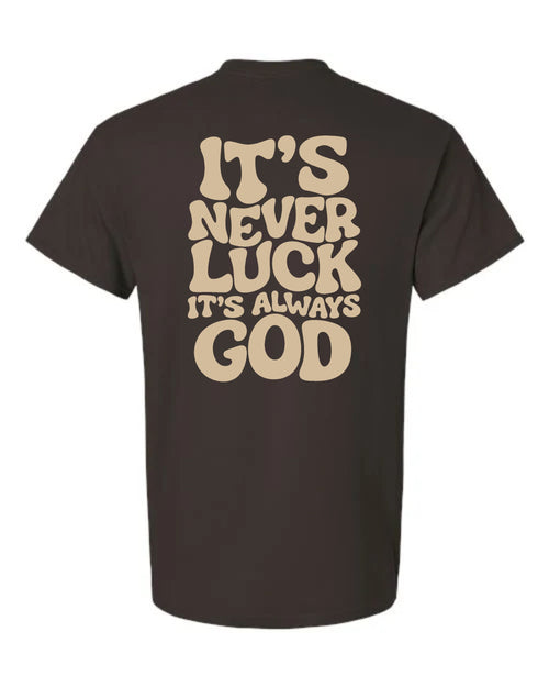 Chocolate brown It's Never Luck It's Always God T-shirt with cream-colored lettering on the back