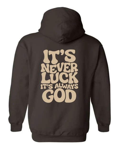 Chocolate brown It's Never Luck It's Always God hoodie with cream-colored lettering across the back