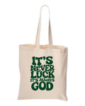 Natural tote bag with green It's Never Luck It's Always God lettering